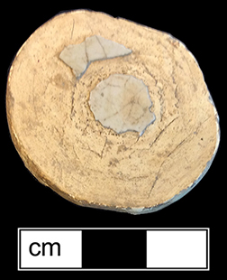 Tin glazed earthenware knobbed lid that has been shaped into a gaming piece - from 18CV91.
